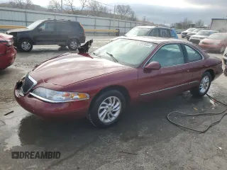 1997 Lincoln Mark VIII with VIN 1LNLM91V8VY676510, listed as a Copart auction lot 82120584 with 63,575 mi miles and Salvage Title. Bid and sale history available at DreamBid. Image 1.