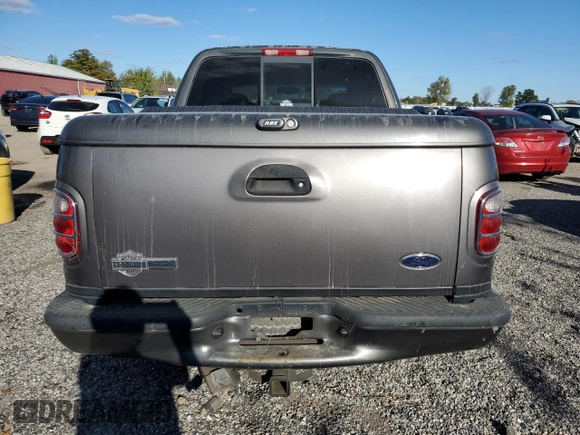 2002 Ford F-150 Harley Davidson with VIN 1FTRW07362KC77880, listed as a Copart auction lot 75259594 with 103,591 mi miles and Salvage Title. Bid and sale history available at carsss.com. Image 6.