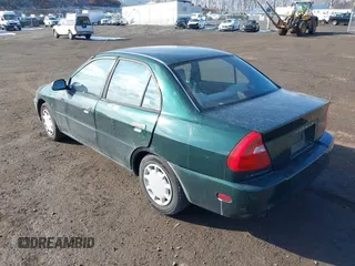 2001 Mitsubishi Mirage ES z VIN JA3AY26C91U041410, wystawiony jako IAAI lot #41360183 z przebiegiem 322 178 mil mil oraz . Historia ofert i sprzedaży dostępna na DreamBid. Obrazek 3.
