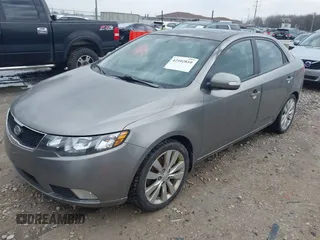 2010 Kia Forte SX with VIN KNAFW4A31A5048066, listed as a IAAI auction lot 42102810 with 160,998 mi miles. Bid and sale history available at carsss.com. Image 2.