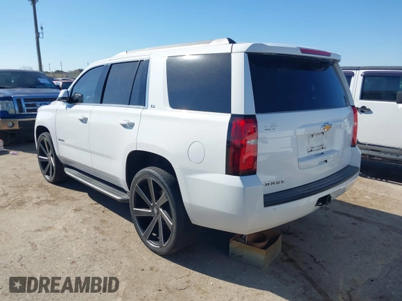 2015 Chevrolet Tahoe LS with VIN 1GNSCAKCXFR748554, listed as a IAAI auction lot 41765865 with 160,282 mi miles and . Bid and sale history available at DreamBid. Image 3.