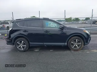 2018 Toyota RAV4 XLE with VIN 2T3WFREVXJW501296, listed as a IAAI auction lot 42358130 with 163,669 mi miles and . Bid and sale history available at DreamBid. Image 14.