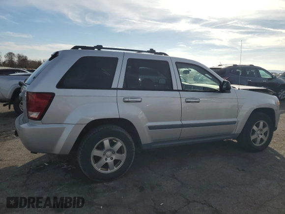 2009 Jeep Grand Cherokee Laredo with VIN 1J8HR48P89C552691, listed as a Copart auction lot 82080964 with 100,876 mi miles and Salvage Title. Bid and sale history available at carsss.com. Image 3.