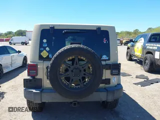 2011 Jeep Wrangler Sahara with VIN 1J4AA5D13BL562732, listed as a IAAI auction lot 41838520 with 148,359 mi miles and . Bid and sale history available at DreamBid. Image 17.