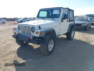 2005 Jeep Wrangler Sport with VIN 1J4FA49SX5P336380, listed as a IAAI auction lot 41752554 with 139,004 mi miles. Bid and sale history available at carsss.com. Image 2.