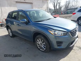 2016 Mazda CX-5 Sport with VIN JM3KE4BY0G0746034, listed as a IAAI auction lot 41842894 with 92,801 mi miles. Bid and sale history available at carsss.com. Image 1.