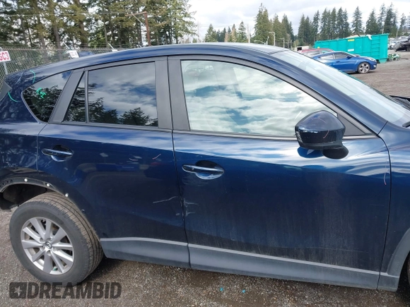 2015 Mazda CX-5 Touring with VIN JM3KE4CY5F0453646, listed as a IAAI auction lot 41740574 with 91,167 mi miles. Bid and sale history available at carsss.com. Image 14.