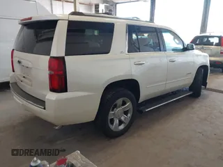 2015 Chevrolet Tahoe LTZ with VIN 1GNSKCKC9FR123996, listed as a IAAI auction lot 42113435 with 149,825 mi miles and . Bid and sale history available at DreamBid. Image 4.