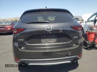 2018 Mazda CX-5 Grand Touring with VIN JM3KFADM3J1389911, listed as a Copart auction lot 60530295 with 103,177 mi miles and Salvage title. Bid and sale history available at DreamBid. Image 6.