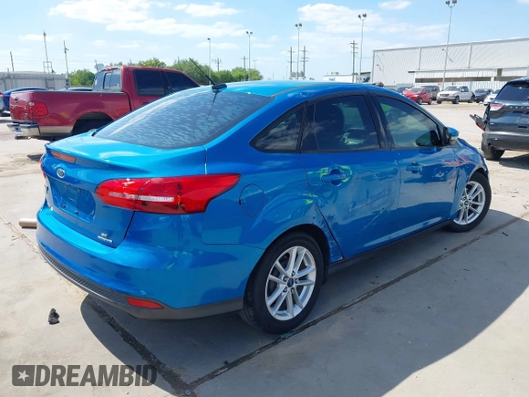 2015 Ford Focus SE with VIN 1FADP3F21FL379837, listed as a IAAI auction lot 42021623 with 146,571 mi miles. Bid and sale history available at carsss.com. Image 4.