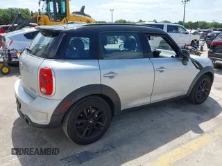2013 MINI Countryman S z VIN WMWZC3C50DWP21636, wystawiony jako IAAI lot #42113244 z przebiegiem 85 344 mil mil oraz . Historia ofert i sprzedaży dostępna na DreamBid. Obrazek 4.