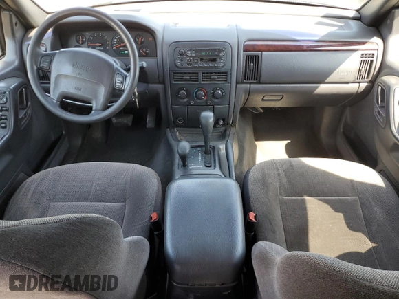 2000 Jeep Grand Cherokee Laredo z VIN 1J4GW48N9YC239166, wystawiony jako Copart lot #53321135 z przebiegiem 142 162 mil mil oraz Szkoda całkowita • Salvage title. Historia ofert i sprzedaży dostępna na DreamBid. Obrazek 8.