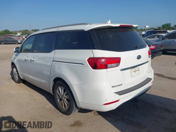 2015 Kia Sedona LX with VIN KNDMB5C10F6027850, listed as a IAAI auction lot 42010344 with 127,019 mi miles. Bid and sale history available at carsss.com. Image 3.