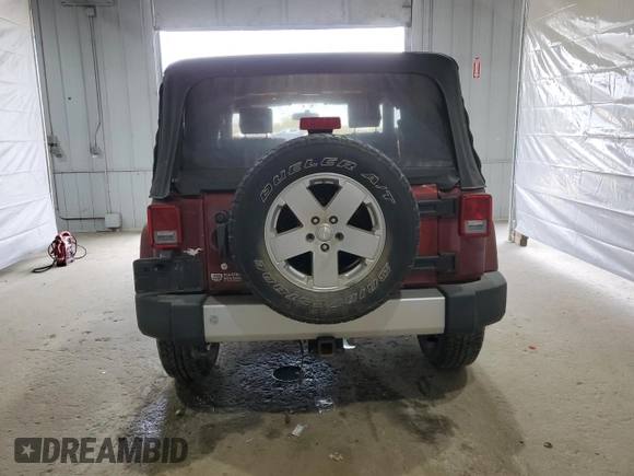 2010 Jeep Wrangler Sahara z VIN 1J4GA5D11AL106768, wystawiony jako Copart lot #56935745 z przebiegiem 143 212 mil mil oraz Szkoda całkowita • Salvage title. Historia ofert i sprzedaży dostępna na DreamBid. Obrazek 6.