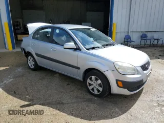 2009 Kia Rio LX with VIN KNADE223396548989, listed as a Copart auction lot 64964304 with 150,426 mi miles and Salvage Title. Bid and sale history available at carsss.com. Image 4.
