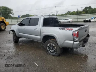2023 Toyota Tacoma SR with VIN 3TMCZ5AN4PM566647, listed as a Copart auction lot 64062034 with 43,154 mi miles and Salvage title. Bid and sale history available at DreamBid. Image 2.