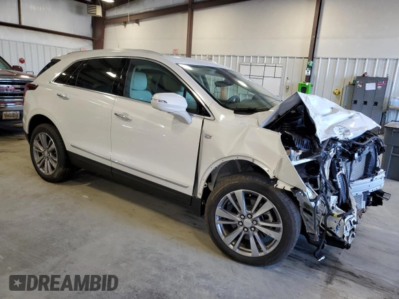 2025 Cadillac XT5 FWD Premium Luxury with VIN 1GYKNCRSXSZ106707, listed as a Copart auction lot 86919854 with 1,879 mi miles and Salvage Title. Bid and sale history available at DreamBid. Image 4.