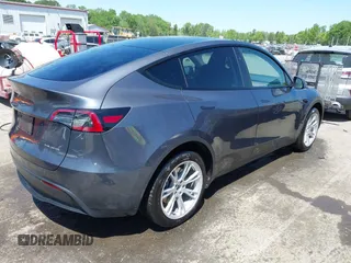 2023 Tesla Model Y Long Range with VIN 7SAYGDEE5PF882582, listed as a IAAI auction lot 42059015 with 10,567 mi miles and . Bid and sale history available at carsss.com. Image 4.