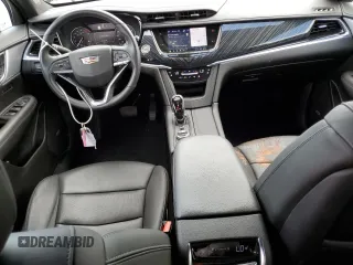 2023 Cadillac XT6 FWD Premium Luxury with VIN 1GYKPCRS5PZ220616, listed as a Copart auction lot 56913725 with 25,860 mi miles and Salvage title. Bid and sale history available at DreamBid. Image 8.