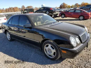 1997 Mercedes-Benz E-Class with VIN WDBJF72F0VA523161, listed as a Copart auction lot 77752804 with 143,495 mi miles and Salvage Title. Bid and sale history available at carsss.com. Image 4.