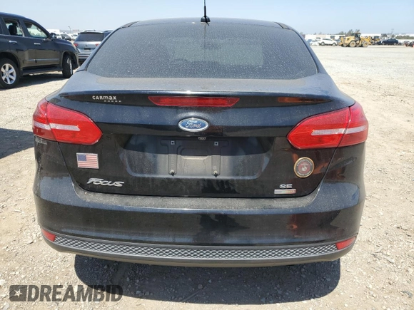 2018 Ford Focus SE z VIN 1FADP3FE0JL293485, wystawiony jako Copart lot #61202625 z przebiegiem 91 025 mil mil oraz Szkoda całkowita • Salvage title. Historia ofert i sprzedaży dostępna na DreamBid. Obrazek 6.