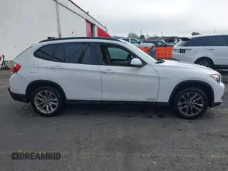 2015 BMW X1 xDrive28i z VIN WBAVL1C54FVY38101, wystawiony jako IAAI lot #41344120 z przebiegiem 130 000 mil mil oraz . Historia ofert i sprzedaży dostępna na DreamBid. Obrazek 12.