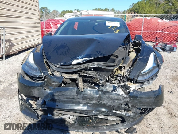 2019 Tesla Model 3 Mid Range with VIN 5YJ3E1EA2KF306286, listed as a IAAI auction lot 41699127 with 56,249 mi miles and . Bid and sale history available at DreamBid. Image 12.
