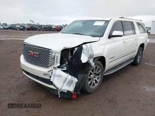 2015 GMC Yukon XL Denali with VIN 1GKS2JKJ2FR590502, listed as a IAAI auction lot 41758575 with 129,777 mi miles. Bid and sale history available at carsss.com. Image 6.