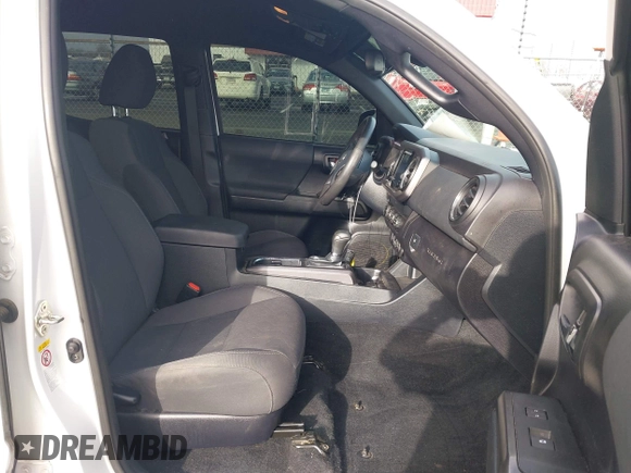 2019 Toyota Tacoma SR z VIN 3TMCZ5AN9KM284092, wystawiony jako IAAI lot #41774851 z przebiegiem 100 031 mil mil oraz . Historia ofert i sprzedaży dostępna na DreamBid. Obrazek 5.