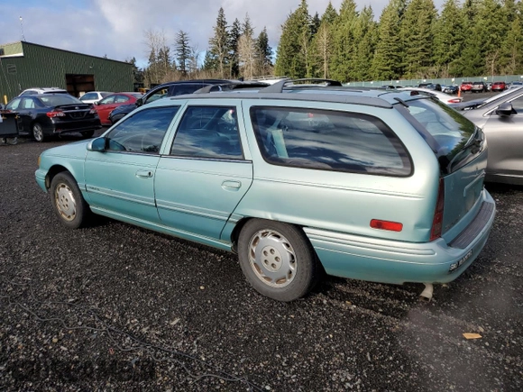 1994 Ford Taurus with VIN 1FALP5747RG236623, listed as a Copart auction lot 85242504 with 205,550 mi miles and Salvage title. Bid and sale history available at DreamBid. Image 2.