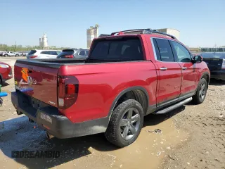 2023 Honda Ridgeline RTL-E with VIN 5FPYK3F76PB016502, listed as a Copart auction lot 54107235 with 27,516 mi miles and Salvage title. Bid and sale history available at DreamBid. Image 3.