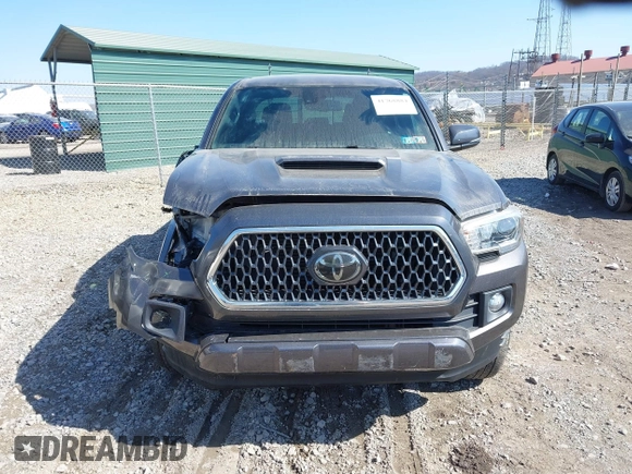 2018 Toyota Tacoma SR with VIN 5TFCZ5AN9JX123749, listed as a IAAI auction lot 41768884 with 42,852 mi miles and . Bid and sale history available at DreamBid. Image 12.