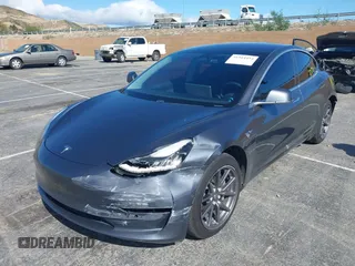 2019 Tesla Model 3 Mid Range with VIN 5YJ3E1EA6KF307456, listed as a IAAI auction lot 41944454 with 99,059 mi miles and . Bid and sale history available at DreamBid. Image 16.