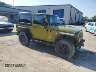 2010 Jeep Wrangler Sahara with VIN 1J4AA5D16AL203910, listed as a Copart auction lot 62891315 with 124,337 mi miles and Salvage title. Bid and sale history available at DreamBid. Image 4.