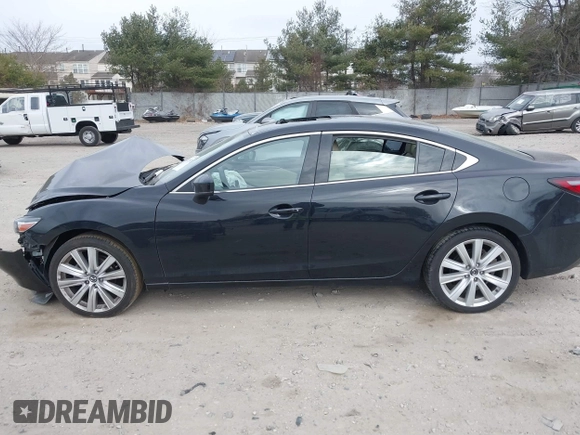 2021 Mazda Mazda6 Touring with VIN JM1GL1VM1M1604566, listed as a IAAI auction lot 41728787 with 68,636 mi miles. Bid and sale history available at carsss.com. Image 14.
