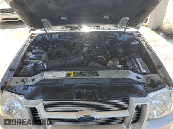 2003 Ford Explorer Sport XLS z VIN 1FMYU60E43UB05641, wystawiony jako Copart lot #87804375 z przebiegiem 130 434 mil mil oraz Szkody całkowita. Historia ofert i sprzedaży dostępna na DreamBid. Obrazek 12.