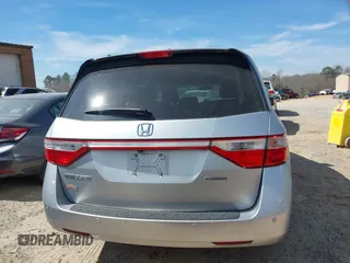 2012 Honda Odyssey Touring with VIN 5FNRL5H92CB108690, listed as a IAAI auction lot 41826580 with 150,327 mi miles and . Bid and sale history available at DreamBid. Image 16.