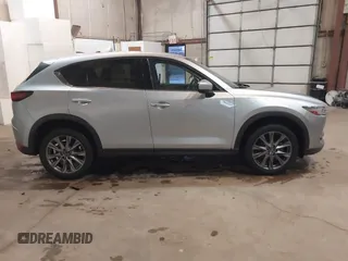 2021 Mazda CX-5 Grand Touring with VIN JM3KFADMXM1318015, listed as a IAAI auction lot 41221528 with 79,473 mi miles. Bid and sale history available at carsss.com. Image 13.
