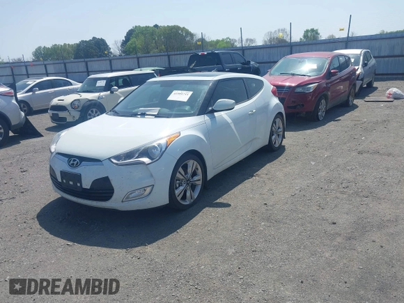 2016 Hyundai Veloster z VIN KMHTC6AD9GU272411, wystawiony jako IAAI lot #41904711 z przebiegiem 133 490 mil mil oraz . Historia ofert i sprzedaży dostępna na DreamBid. Obrazek 2.