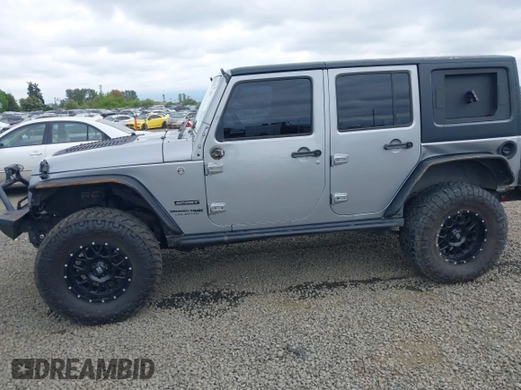 2018 Jeep Wrangler Unlimited Sport S with VIN 1C4BJWDG4JL861052, listed as a IAAI auction lot 42100517 with 43,907 mi miles and . Bid and sale history available at DreamBid. Image 6.