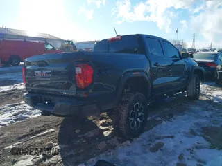2024 GMC Canyon 4WD AT4X with VIN 1GTP6EEK7R1222174, listed as a IAAI auction lot 41377759 with 2,642 mi miles. Bid and sale history available at carsss.com. Image 4.