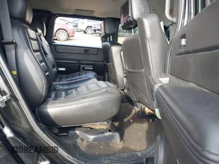 2006 Hummer H2 with VIN 5GRGN23U06H113353, listed as a IAAI auction lot 41476649 with 165,370 mi miles. Bid and sale history available at carsss.com. Image 8.