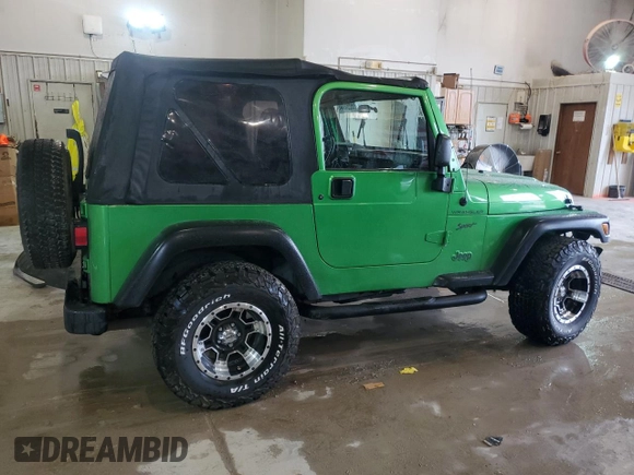 2002 Jeep Wrangler Sport with VIN 1J4FA49S72P701075, listed as a Copart auction lot 66894914 with 169,971 mi miles and Salvage Title. Bid and sale history available at carsss.com. Image 3.