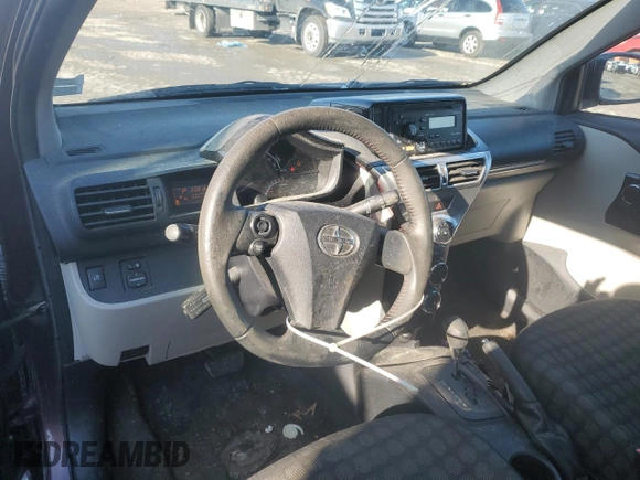 2012 Scion iQ z VIN JTNJJXB00CJ014966, wystawiony jako Copart lot #83100954 z przebiegiem 100 775 mil mil oraz Szkoda całkowita • Salvage title. Historia ofert i sprzedaży dostępna na DreamBid. Obrazek 8.