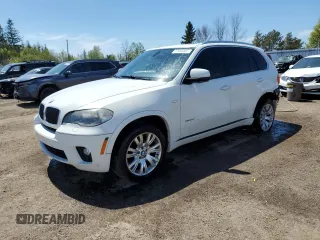 2012 BMW X5 35i z VIN 5UXZV4C59CL759335, wystawiony jako Copart lot #57055065 z przebiegiem 180 589 mil mil oraz Czysty tytuł • Clean title. Historia ofert i sprzedaży dostępna na DreamBid. Obrazek 1.
