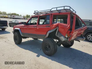 1996 Jeep Cherokee Country with VIN 1J4FJ78S9TL130605, listed as a Copart auction lot 74673934 with 196,857 mi miles and Salvage Title. Bid and sale history available at carsss.com. Image 2.