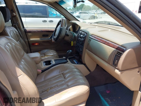 2000 Jeep Grand Cherokee Laredo with VIN 1J4G258S4YC381030, listed as a IAAI auction lot 42541918 with 306,934 mi miles and . Bid and sale history available at DreamBid. Image 5.