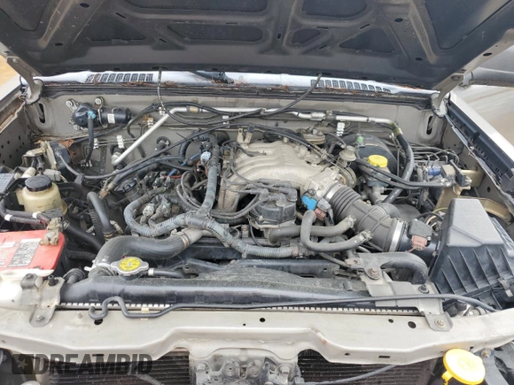 2004 Nissan Frontier XE Desert Runner z VIN 1N6ED26T84C448365, wystawiony jako Copart lot #56487435 z przebiegiem 266 738 mil mil oraz Czysty tytuł • Clean title. Historia ofert i sprzedaży dostępna na DreamBid. Obrazek 11.