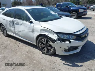 2018 Honda Civic EX-T z VIN JHMFC1F39JX032719, wystawiony jako IAAI lot #42104476 z przebiegiem 118 947 mil mil oraz . Historia ofert i sprzedaży dostępna na DreamBid. Obrazek 1.