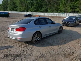 2013 BMW 3 Series 328i with VIN WBA3C1C54DK103415, listed as a IAAI auction lot 42147590 with 113,188 mi miles and . Bid and sale history available at carsss.com. Image 4.